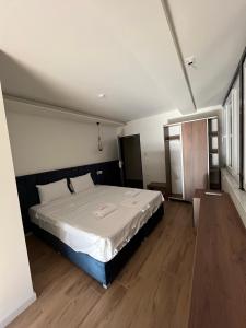 Postel nebo postele na pokoji v ubytování Kubi Hotel