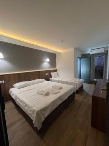 Postel nebo postele na pokoji v ubytování Kubi Hotel