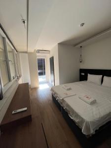 Postel nebo postele na pokoji v ubytování Kubi Hotel