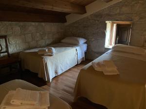 Postel nebo postele na pokoji v ubytování Agriturismo Il Melograno