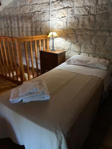 Postel nebo postele na pokoji v ubytování Agriturismo Il Melograno