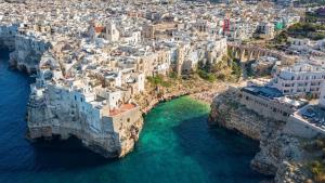 an aerial view of the amalfi coast with white buildings at Palazzo Marzionna in Polignano a Mare