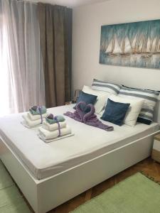 Posteľ alebo postele v izbe v ubytovaní Apartments SARA