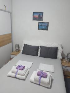 Posteľ alebo postele v izbe v ubytovaní Apartments SARA