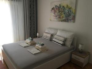 Posteľ alebo postele v izbe v ubytovaní Apartments SARA