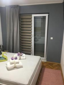 Posteľ alebo postele v izbe v ubytovaní Apartments SARA