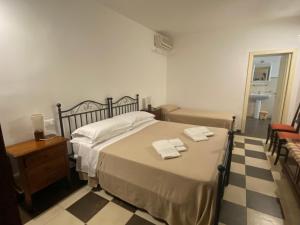 Postel nebo postele na pokoji v ubytování Agriturismo Il Melograno