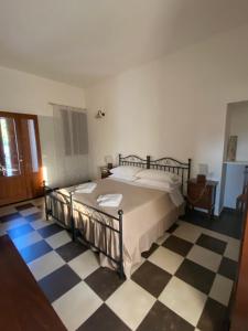 Postel nebo postele na pokoji v ubytování Agriturismo Il Melograno