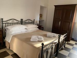 Postel nebo postele na pokoji v ubytování Agriturismo Il Melograno