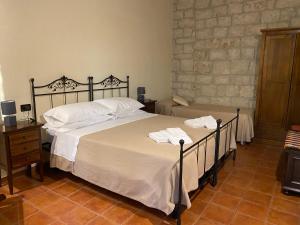Postel nebo postele na pokoji v ubytování Agriturismo Il Melograno