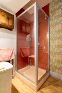 a shower with a glass door in a bathroom at The Tallow Factory in Dedham in Dedham