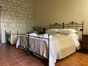 Postel nebo postele na pokoji v ubytování Agriturismo Il Melograno