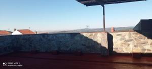 a shadow on a wall with a mountain in the background at Hostal 2 estrellas -Restaurante Las Tres Encinas in Cabeza la Vaca