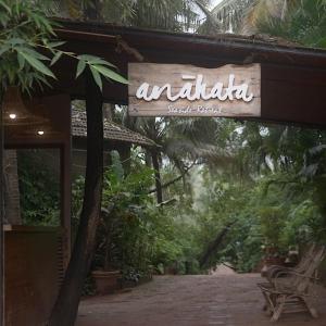 a sign for anahida social club in a resort at Anahata Retreat Sea Front Resort Ashvem Goa in Mandrem