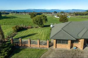 an aerial view of a house with a fence at Rotorua Lake View Villa in Hamurana