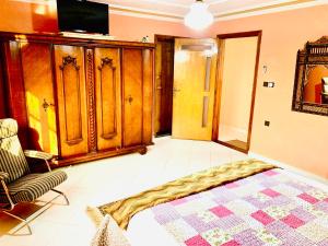 Giường trong phòng chung tại Gite Karima