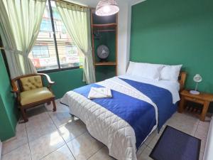 Hostal Puyo客房内的一张或多张床位