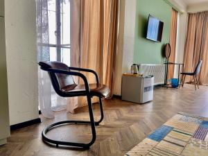 Televiisor ja/või meelelahutuskeskus majutusasutuses Claude Monet Seaside Hotel
