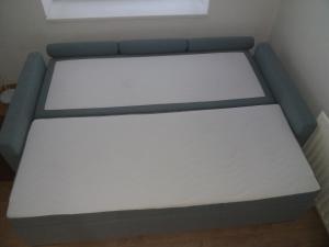 Postel nebo postele na pokoji v ubytování Apartmán Na Skále