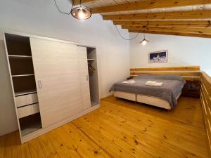 a bedroom with a bed and a walk in closet at Chalten Mountain Lofts 3 in El Chalten