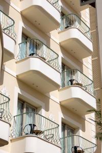 a facade of a building with balconies at Leonardo Boutique Hotel Larnaca in Larnaca