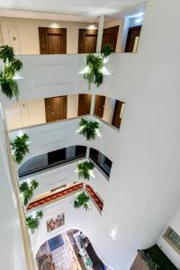 an overhead view of a building with potted plants at Leonardo Boutique Hotel Larnaca in Larnaca