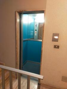 a glass elevator in a building with a mirror at Appartamento Riviera Trilocale wifi e parcheggio privato in Ventimiglia +44 photos