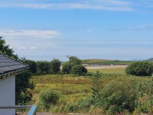 a view of a field from a house at Mulranny Bay Apartment in Mulranny