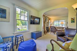 a living room filled with furniture and a mirror at Lakefront Cottage with Covered Porch and Dock! in Coventry