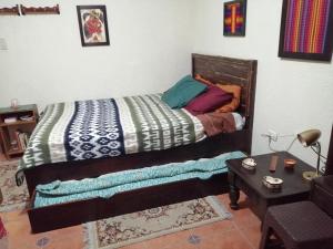 Cama o camas de una habitación en CASA ICHIK ANTIGUA GUATEMALA