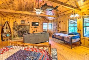 a bedroom with two beds and a fireplace in a cabin at Mountian View Retreat Less Than 2 Mi to White River! in Mountain View