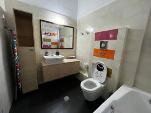a bathroom with a toilet and a sink at The Spartan Penthouse in Sparti +39 photos