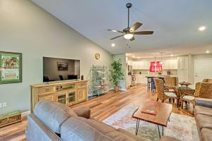 a living room with a couch and a table at Bull Shoals Condo Retreat about 1 Mi to Marina! in Bull Shoals