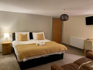 a bedroom with a large bed in a room at The Herbalist Rooms in Retford