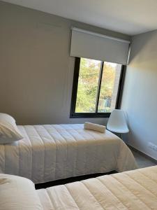Кровать или кровати в номере Bodega de Coria A - Urbesur