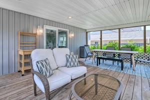 a living room with a couch and a table at Idyllic Pasadena Retreat with Garden and Hot Tub! in Glen Burnie