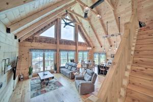 an overhead view of a living room and dining room in a log home at Luxe Log Cabin with Modern Finishes and Mtn Views in Maggie Valley