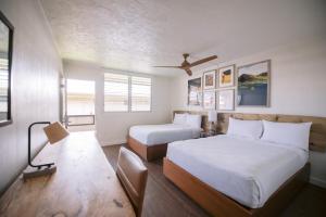 Ένα ή περισσότερα κρεβάτια σε δωμάτιο στο SCP Hilo Hotel