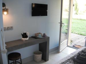 TV a/nebo společenská místnost v ubytování Le Brame - Chambres d'Hôtes