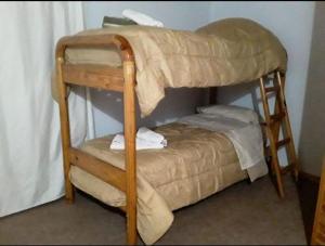 a couple of bunk beds in a room at Brisas Andinas in Malargüe