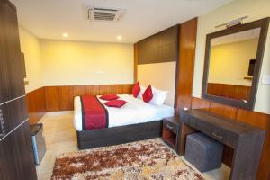 Una cama o camas en una habitación de Hotel Meridian Suite