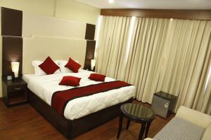 Una cama o camas en una habitación de Hotel Meridian Suite