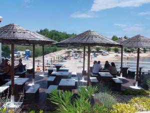 A restaurant or other place to eat at Family friendly apartments with a swimming pool Vir - Lozice, Vir - 13569