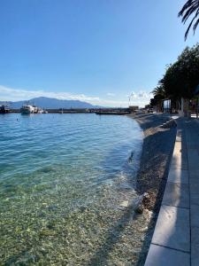 a view of a body of water with a beach at Rooms by the sea Gradac, Makarska - 16006 in Gradac