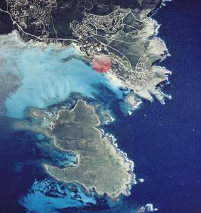 a satellite view of an island in the water at Rocca Ruja Vip in Stintino