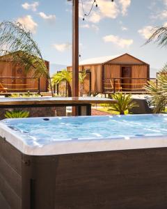 a hot tub in the middle of a yard at Indomito Resort & Hotel Boutique in Valle de Guadalupe