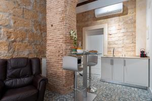 a kitchen with a couch and a counter in a room at Tosca 2 PAX by costablancarent in Denia +41 photos
