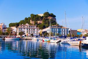 a bunch of boats are docked in a harbor at Tosca 2 PAX by costablancarent in Denia