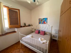 Postel nebo postele na pokoji v ubytování La Casa sulla Spiaggia: Dimora Elma