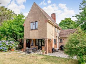 an old brick house with a pointed roof at Longsdon in Haverfordwest